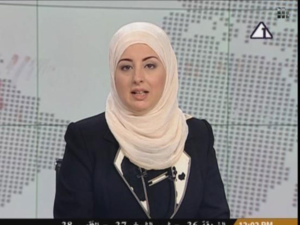 Fatma Nabil read the news on state television wearing a headscarf on Sunday