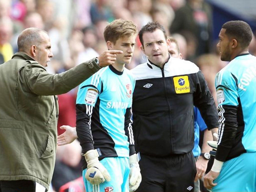 Paolo Di Canio substitutes Wes Foderingham (right) with Leigh Bedwell, provoking an angry reaction from the goalkeeper