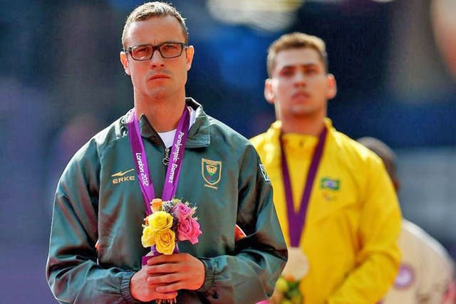 Oscar Pistorius (left) with his conqueror Oliveira at yesterday’s
medal ceremony