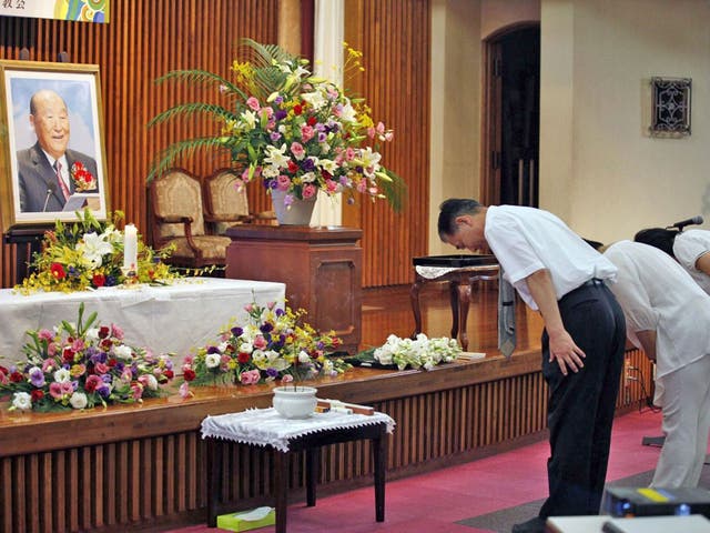 Followers pay their respects to the Rev Moon at a Church in Tokyo
yesterday