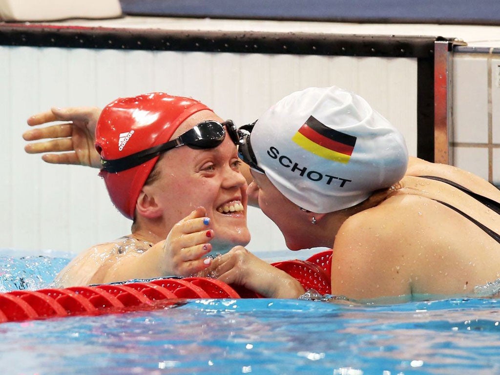 Ellie Simmonds celebrates her world record win, in 3:05.39, in the women’s SM6 200m individual medley with silver medallist Verena Schott of Germany