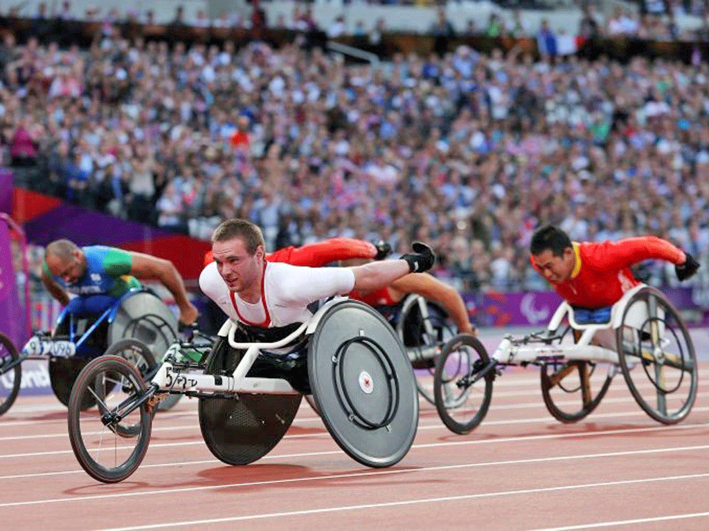 Mickey Bushell led from start to finish to win his 100m final in a
record time
