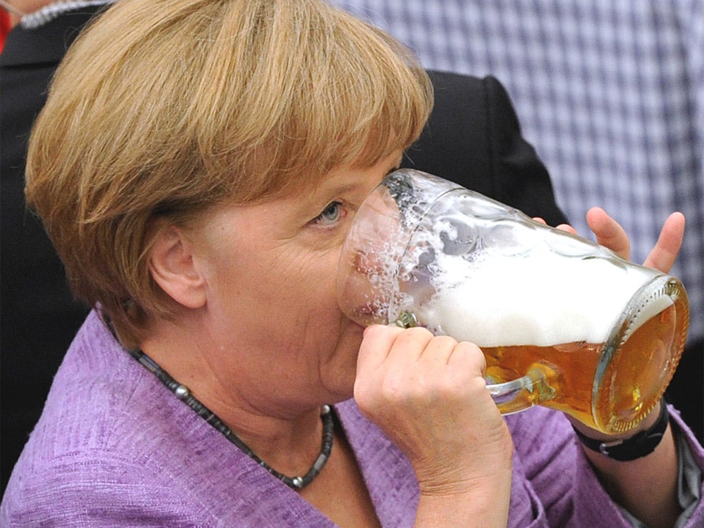 Angela Merkel at the beer tent in Abensberg, near Munich, where she called for action on the euro
