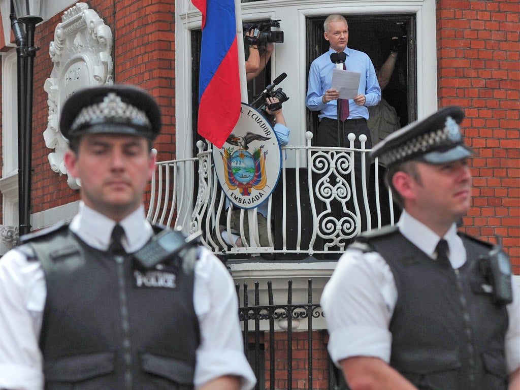 Julian Assange addressing supporters last month from the Ecuadorian embassy where he has sought refuge
