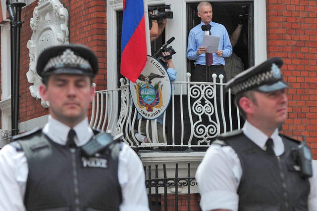 Julian Assange addressing supporters last month from the Ecuadorian embassy where he has sought refuge