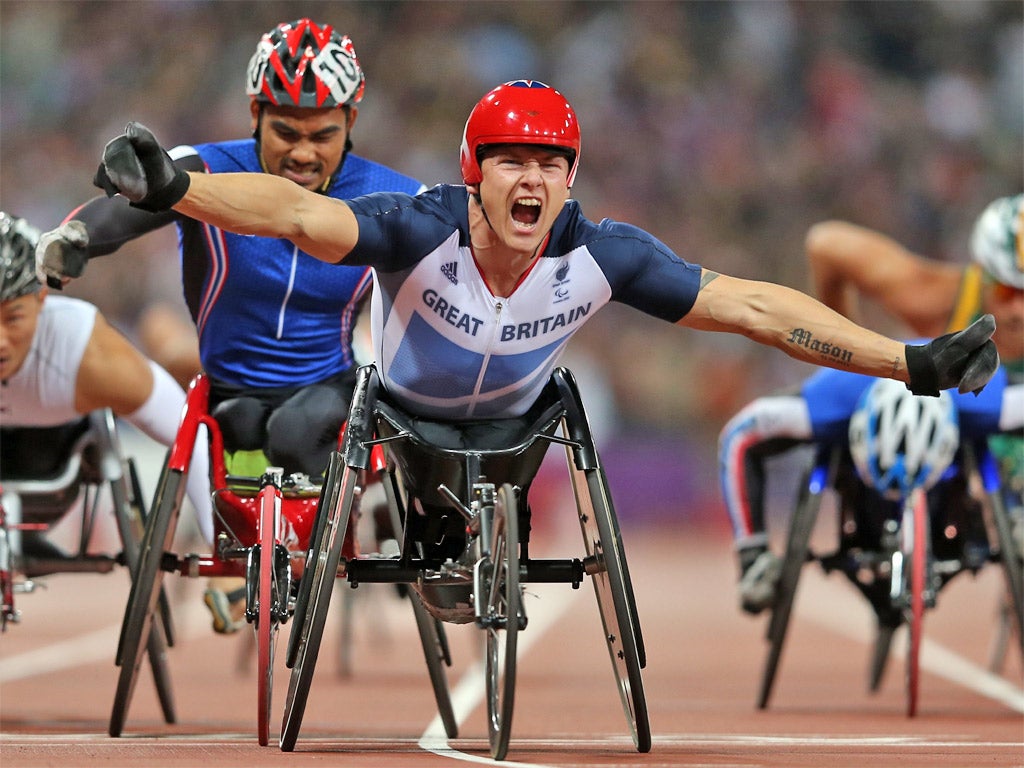 David Weir celebrates his victory as he crosses the finish line in the T54 1500m final