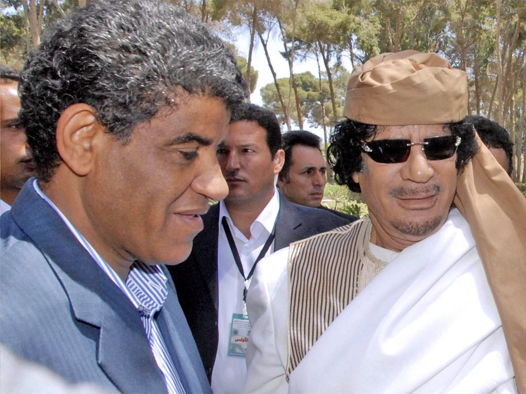 Abdullah al-Senussi, pictured with Gaddafi