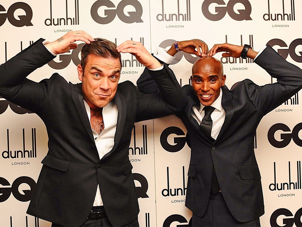 Robbie Williams is delighted to be pictured with international superstar Mo Farah