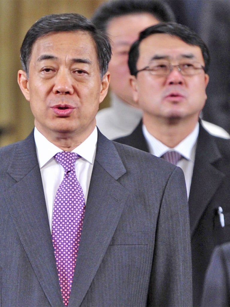 Xilai, front, China’s disgraced party leader, with police chief Wang Lijun in January this year