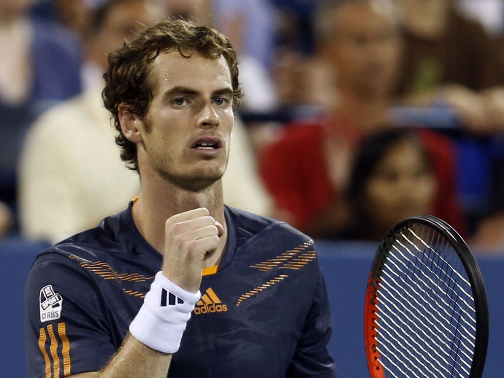 Andy Murray reacts after defeating Marin Cilic in their men's quarter-final match