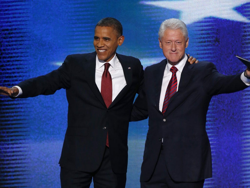 President Barack Obama joins former president Bill Clinton onstage during the second session of the Democratic National Convention in Charlotte