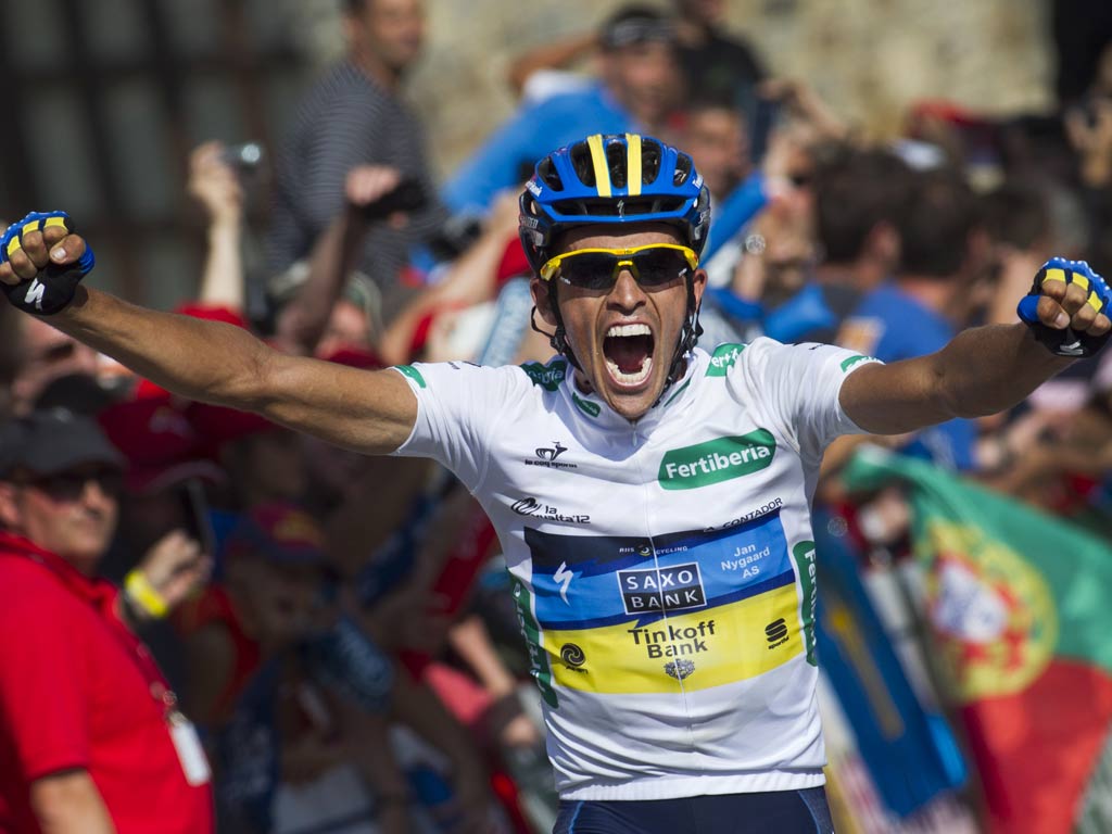 Alberto Contador crosses the line on stage 17