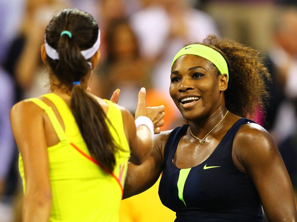 Serena Williams celebrates after reaching the semi-finals of the US Open