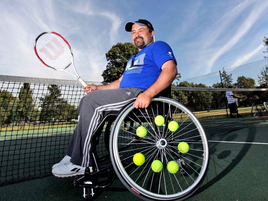 James Moore testing out his wheelchair tennis skills