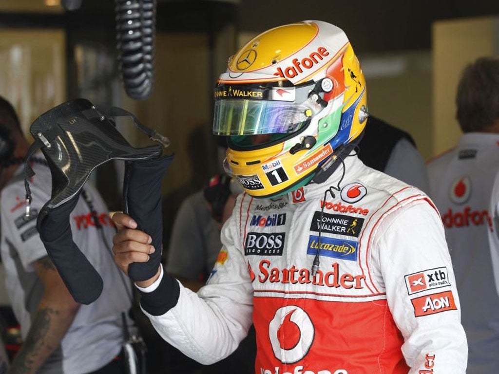 Lewis Hamilton makes a point to his pit crew during training for the Italian Grand Prix