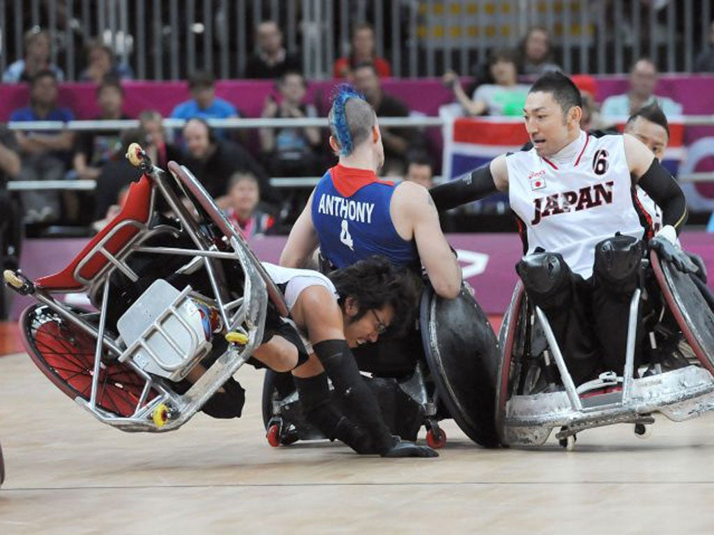 Japan’s Daisuke Ikezaki collides with GB’s David Anthony during a typically full-blooded encounter