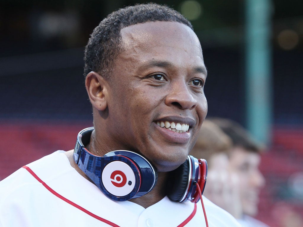 Dr Dre wearing his trademark earphones