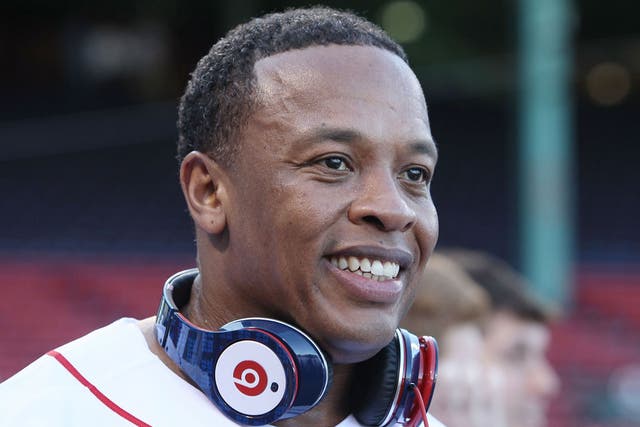 Dr Dre wearing his trademark earphones