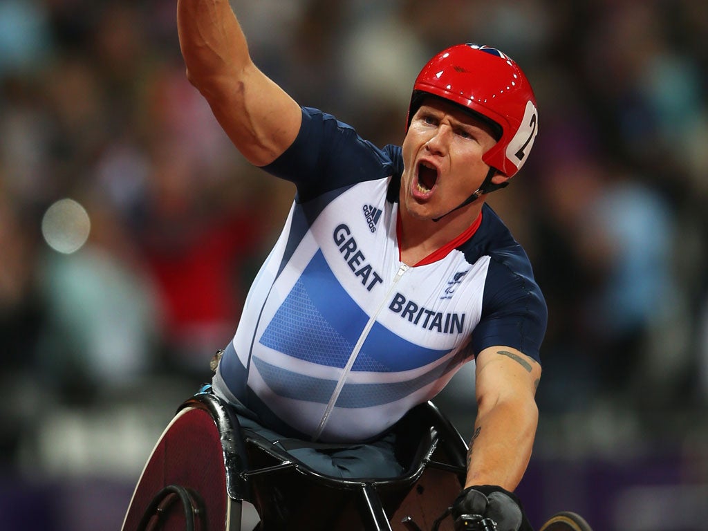 Big shout: David Weir wins gold in the T54 5,000m, and aims to add the marathon title today