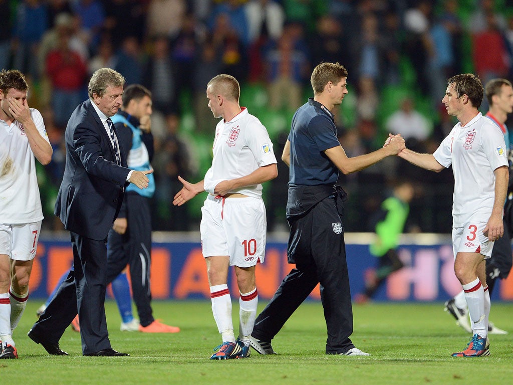 Job well done: England's No 10 Tom Cleverley gets a handshake from manager Roy Hodgson after the 5-0 win against Moldova