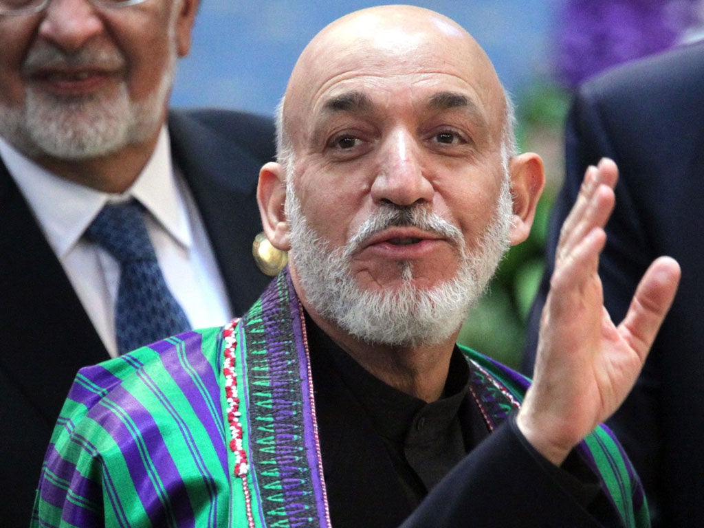 President Hamid Karzai, above, would be a figurehead under plans by MP Tobias Ellwood