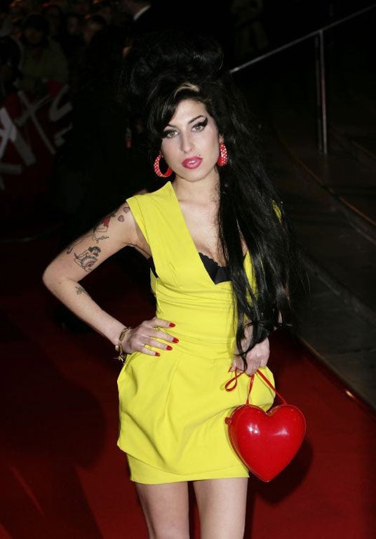 Amy Winehouse wore the label's signature power dress