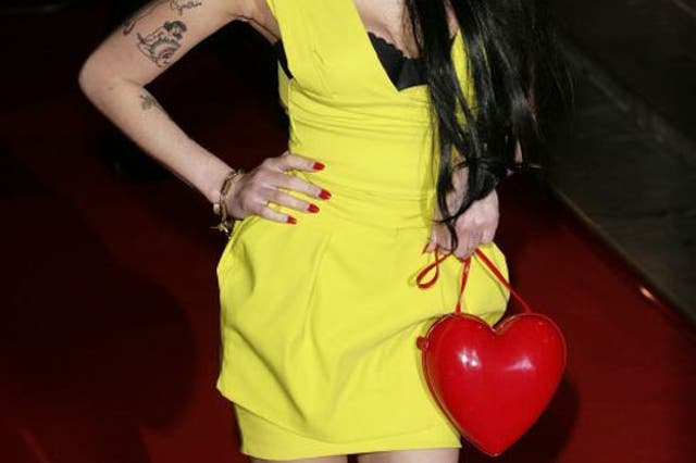 Amy Winehouse wore the label's signature power dress