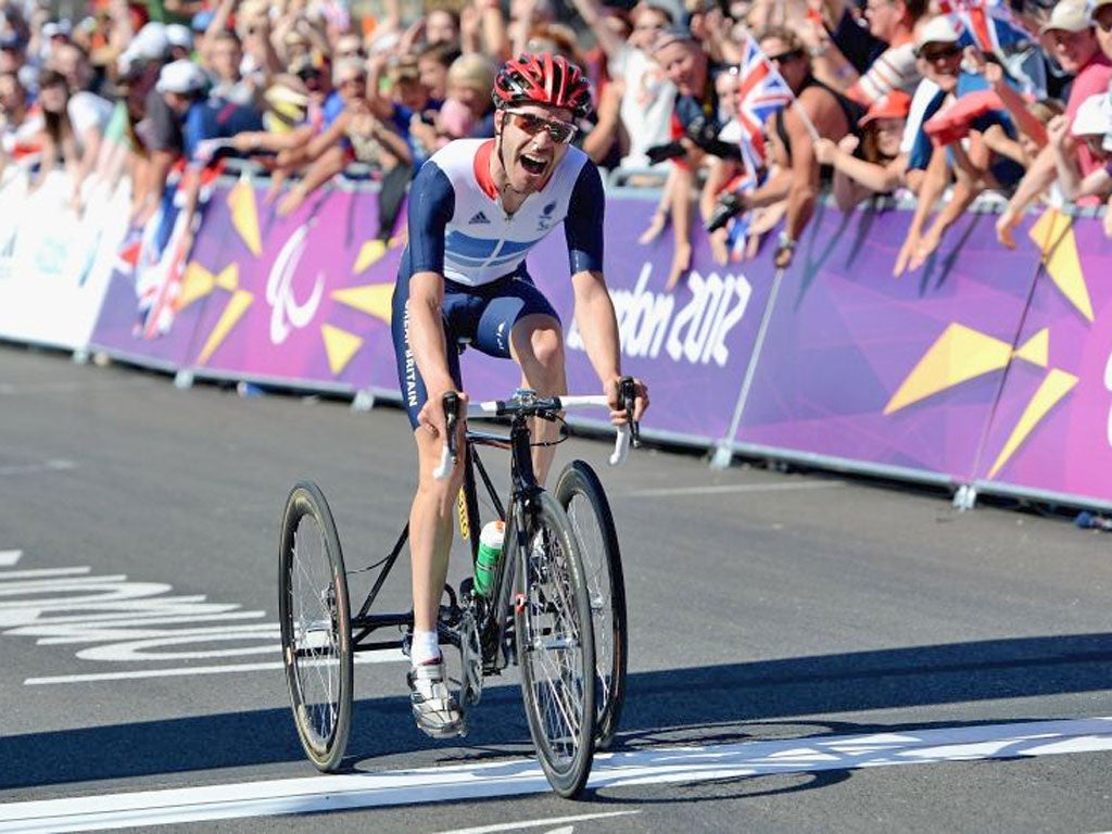 David Stone crosses the line to win T1-2 road race gold on Saturday