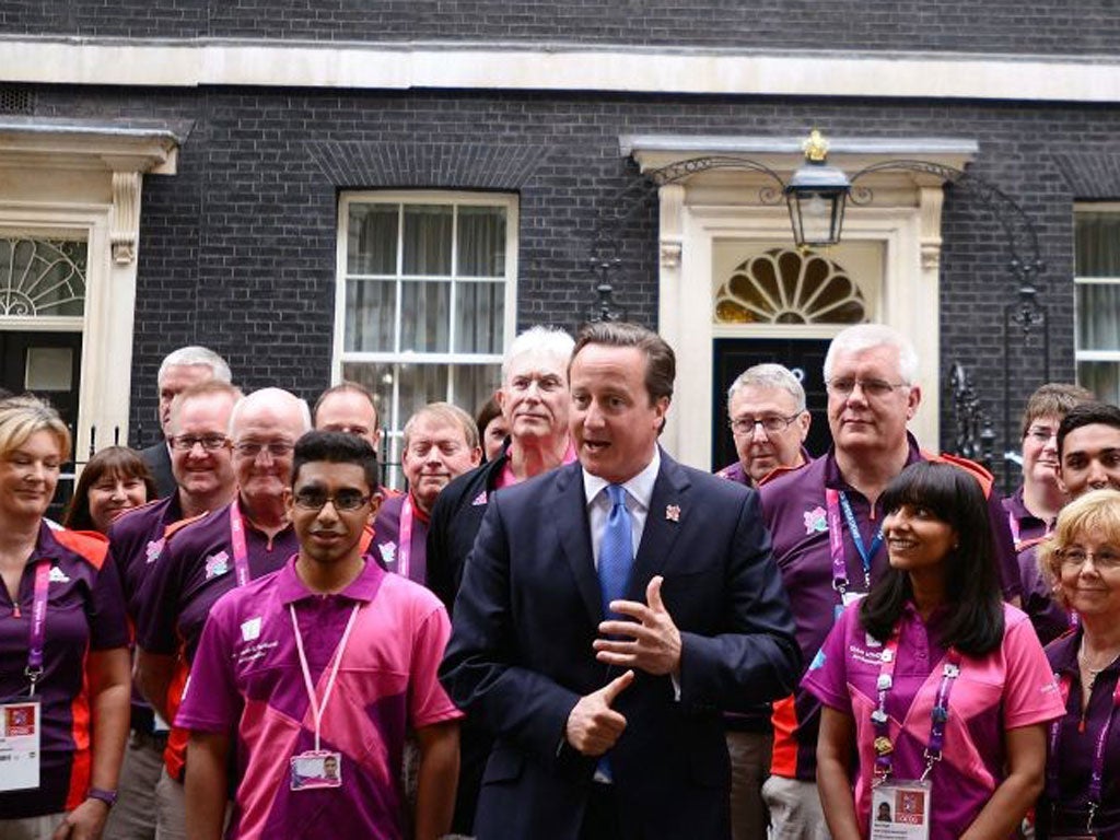 David Cameron greets Olympic Games Makers at No 10 yesterday before the Olympics parade