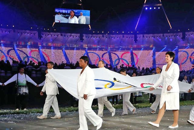 Doreen Lawrence holding the Olympics flag at the Opening Ceremony