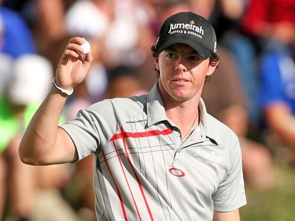 Rory McIlroy of Northern Ireland reacts after he made his final putt on the 18th green to finish -20 and win the tournament during the final round of the BMW Championship