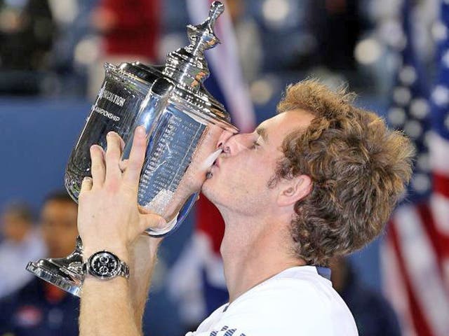 Andy Murray kisses the US Open championship trophy after defeating Novak Djokovic in the men's singles final match of the 2012 US Open