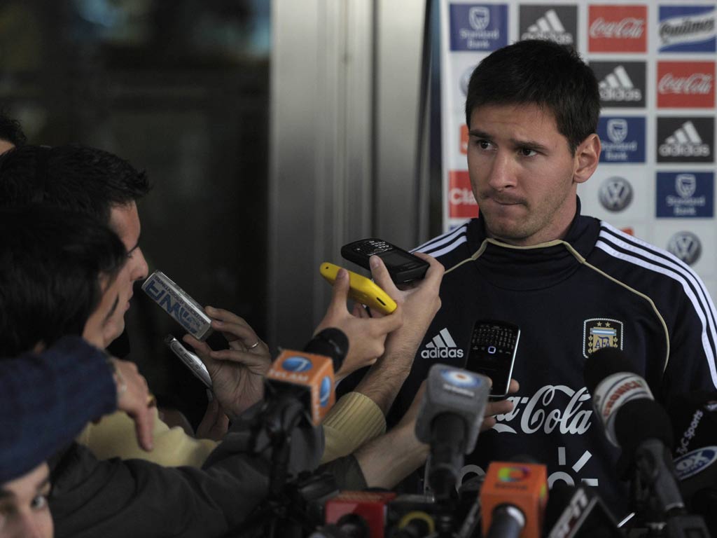 Lionel Messi speaks to the press after a training session in Ezeiza, Buenos Aires