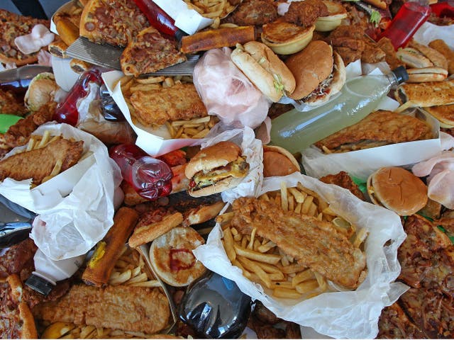 MELBOURNE, AUSTRALIA - MARCH 06: Junk food sits on a table as British Celebrity Chef Jamie Oliver announces a partnership to attack state-wide obesity