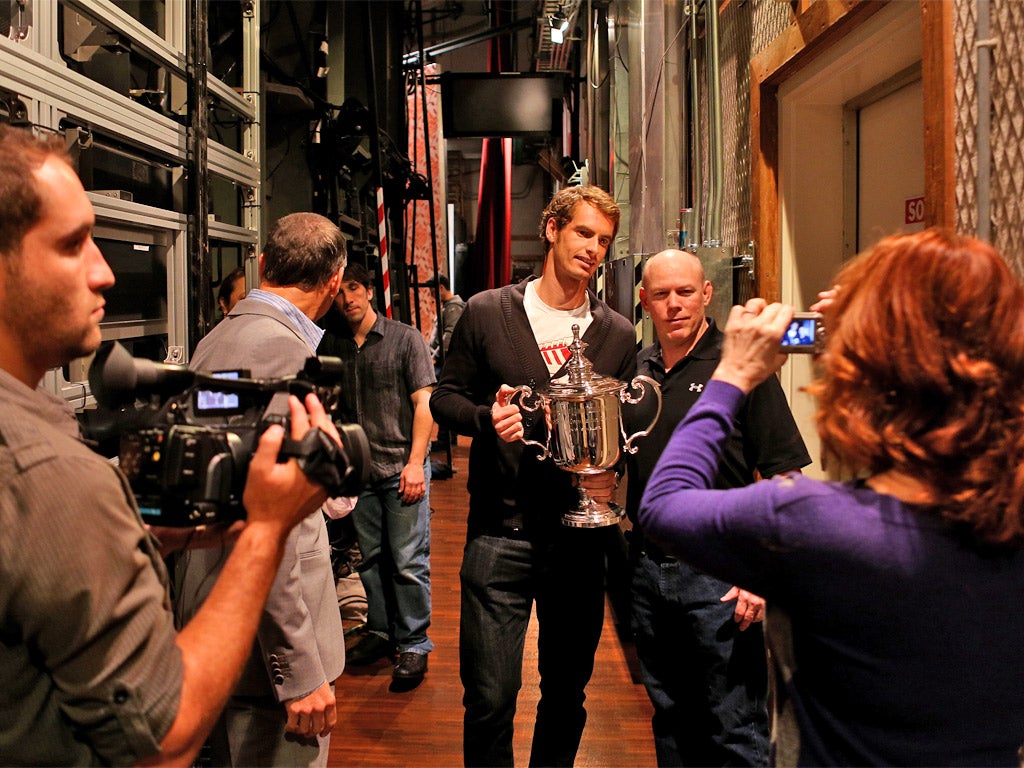Andy Murray with the US Open trophy backstage on the US morning TV show, Live With Kelly and Michael