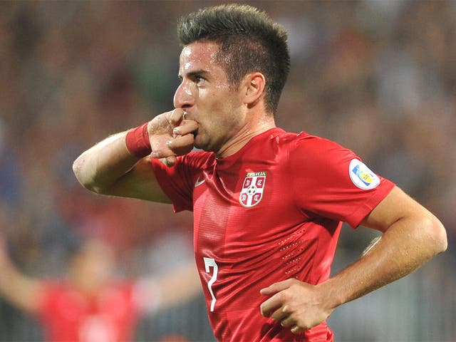 Zoran Tosic reacts after scoring Serbia’s second goal against Wales