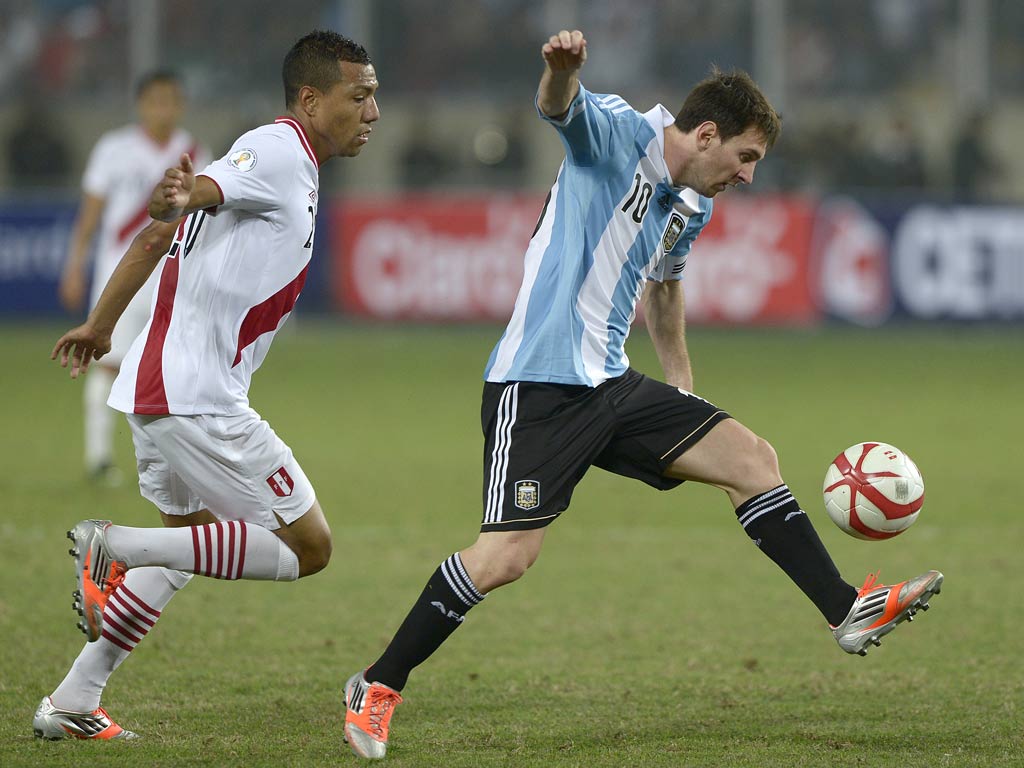 Lionel Messi in action against Peru