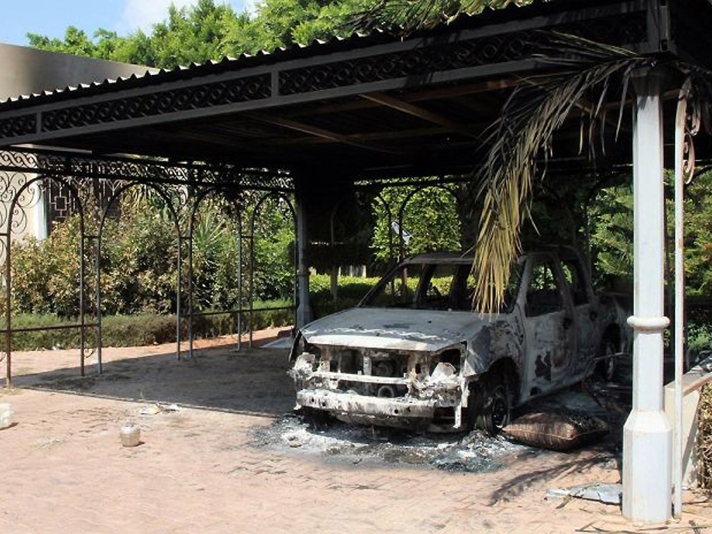 The wreckage of a car inside the US Embassy compound in Benghazi, Libya, following an overnight attack in which the US ambassador to Libya and three of his colleagues were killed