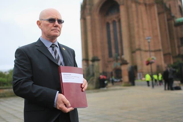 Steve Kelly of the Hillsborough Justice Campaign poses outside Liverpool Anglican Cathedral with his copy of the independent report into the 1989 Hillsborough Disaster on September 12, 2012 in Liverpool, England. 