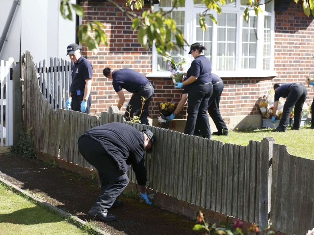 Police search the Al-Hillis' home in Claygate, Surrey, yesterday
