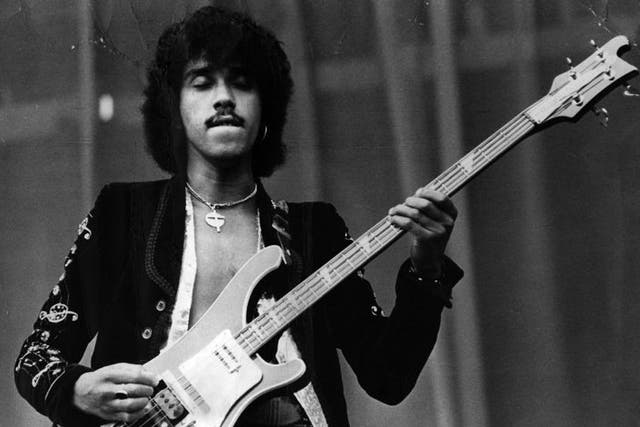Phil Lynott (1951 - 1986) on stage with Thin Lizzy