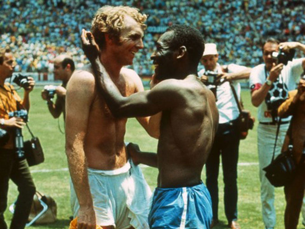 Pele and Moore embrace in 1970 in one of football’s iconic images