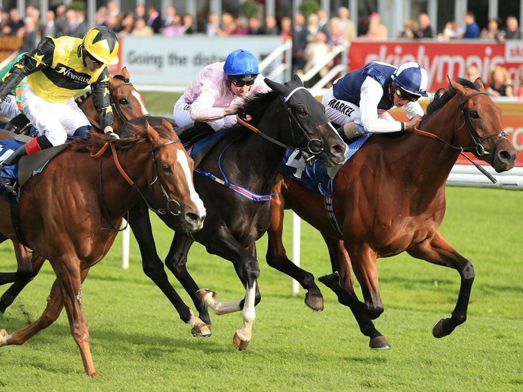 Times Up (centre) wins the Doncaster Cup for trainer John Dunlop