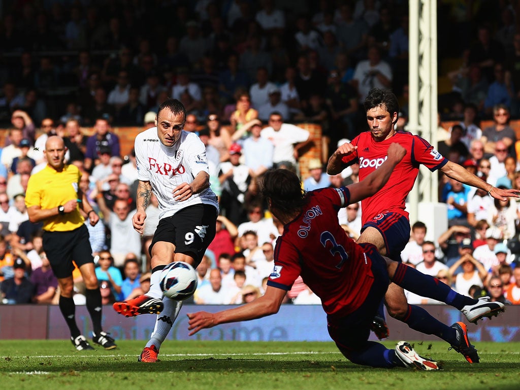 15 September 2012 Dimitar Berbatov scores the first of two goals against West Brom on his home debut for Fulham.