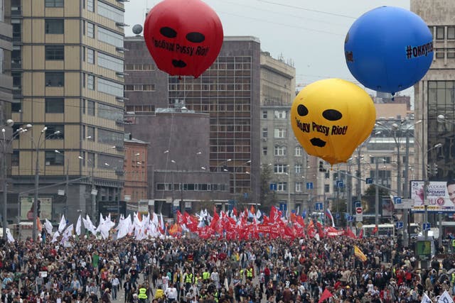 Marchers in Moscow yesterday: the balloons recall the Pussy Riot protest