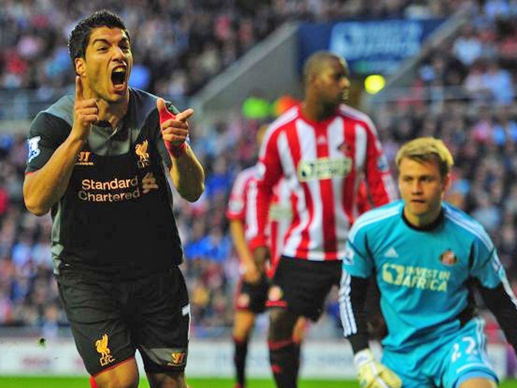 Liverpool striker Luis Suarez celebrates scoring the equaliser at the
Stadium of Light