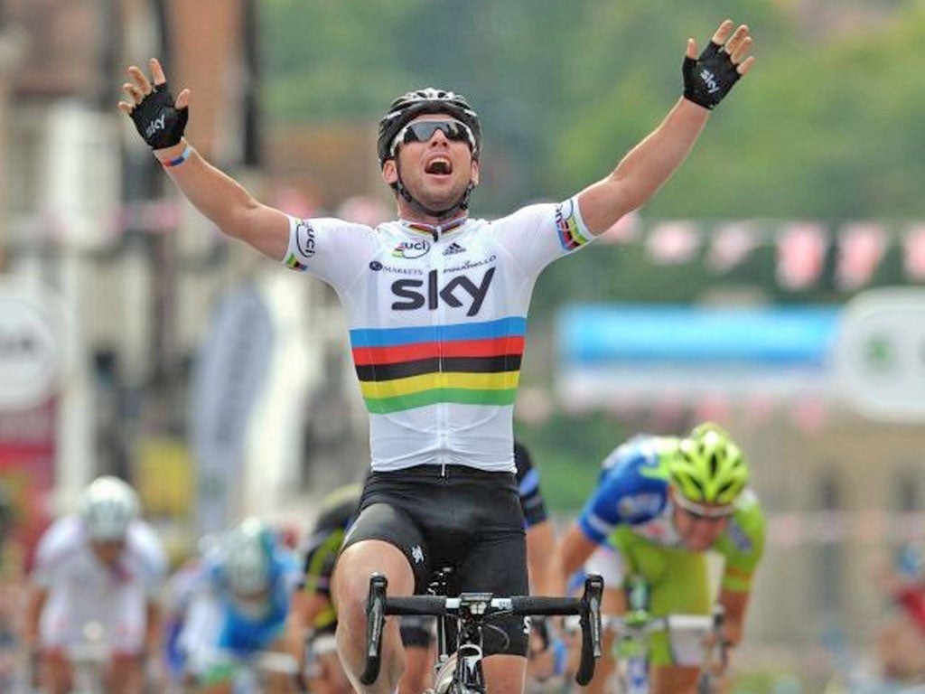 Mark Cavendish raises his arms after winning stage eight yesterday