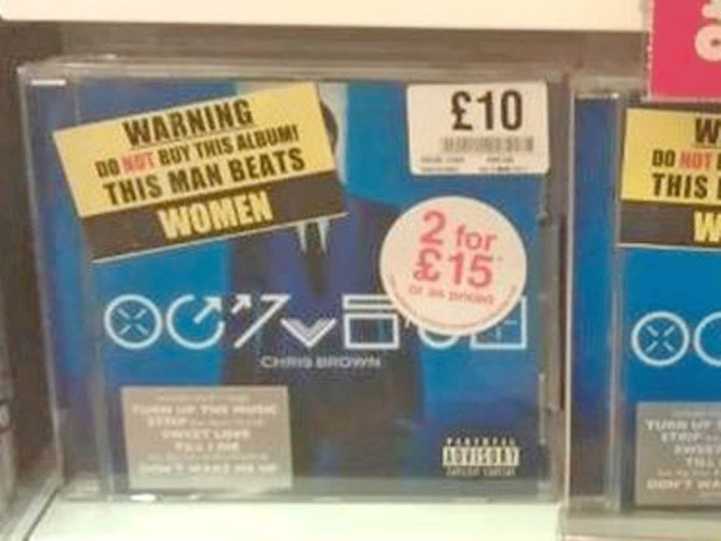 Stickers reading “Warning – Do not buy this album! This man beats women” on copies of Chris Brown’s new record