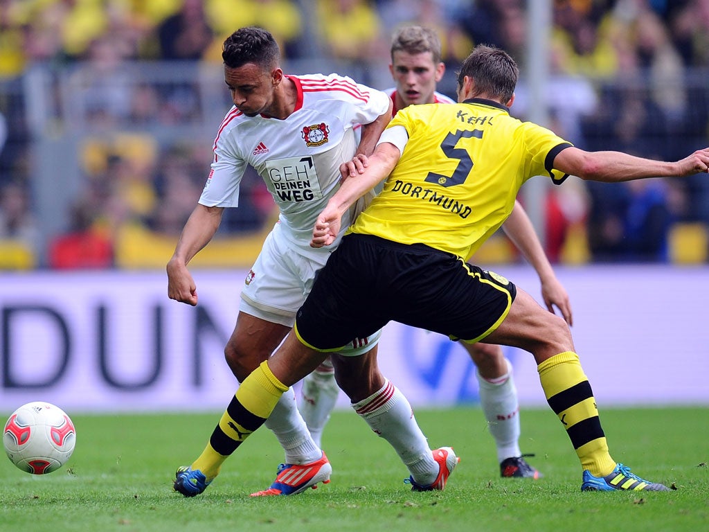 Defending Bundesliga champions Borussia Dortmund beat Bayer Leverkusen 3-0