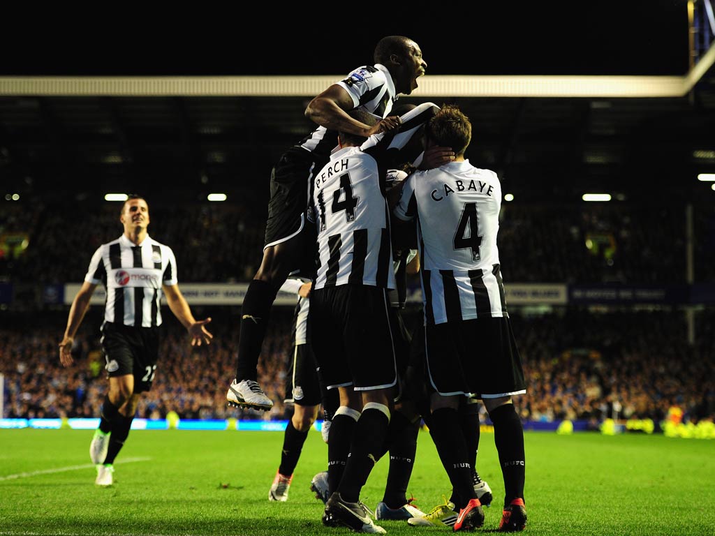 Newcastle celebrate Demba Ba's late equaliser against Everton